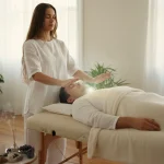 Hands channeling gentle healing energy during a Reiki session, symbolising balance, relaxation, and emotional wellbeing.