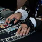 History Of Tarot ... Person from times past playing with tarot cards