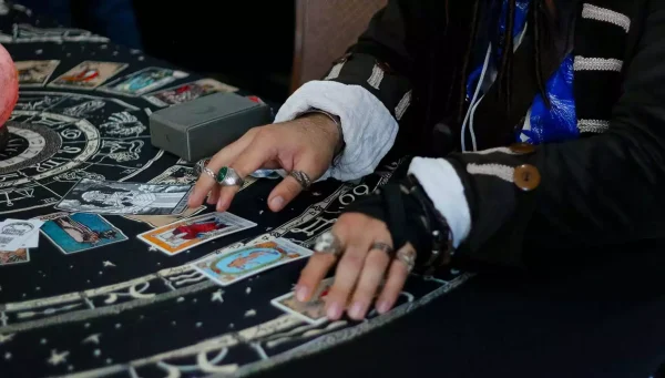 History Of Tarot ... Person from times past playing with tarot cards